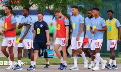 England players head to the pitch to warm up before a friendly against Sporting Kansas City