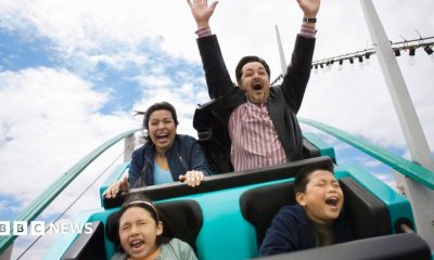 A stock image of a family enjoying a rollercoaster.