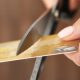 woman cuts a credit card in half