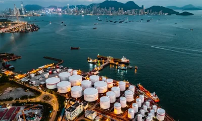 Tank ship loading unloading oil and gasoline at Commercial dock in sea