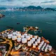 Tank ship loading unloading oil and gasoline at Commercial dock in sea