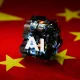 Abstract AI Symbol Hovering Above Chinese Flag – Representing AI Innovation and Technology in China