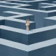 Hand reaching out from inside a giant maze, concept of confusion, struggle, help, mental exhaustion, problem solving and stress, 3d render