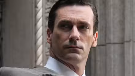 Jon Hamm's Don Draper looking over his shoulder in Mad Men
