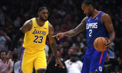 LeBron James defends Kawhi Leonard during Lakers vs. Clippers NBA 2019-20 season opener.