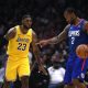 LeBron James defends Kawhi Leonard during Lakers vs. Clippers NBA 2019-20 season opener.