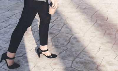 woman walks on cobblestone street; she must be wearing one of our top affordable comfortable heel brands