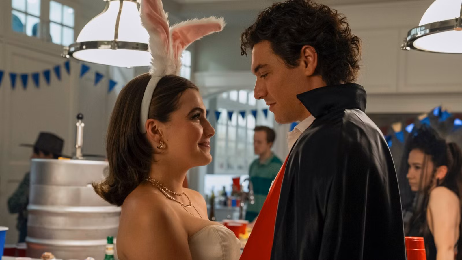 Hannah and Garrett at a themed birthday party in 'Off Campus' Season 1, Episode 2