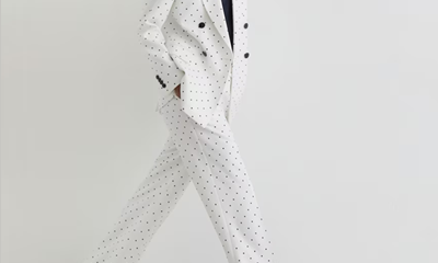white suit with navy polka dots