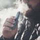 Man,Smokes,New,Vape,Pod,System,,Inhales,And,Exhales,Vapor