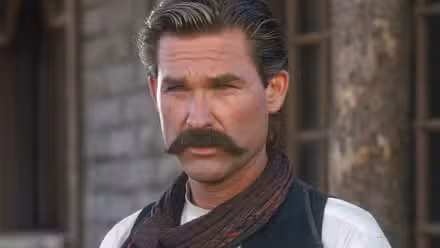 Kurt Russell as Wyatt Earp squints his eyes in 'Tombstone'