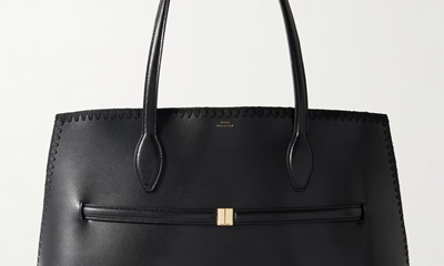 black leather tote with belt and whipstitch detailing