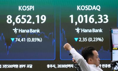 Asian shares are mixed and oil stays below $80 as world awaits details on US-Iran deal