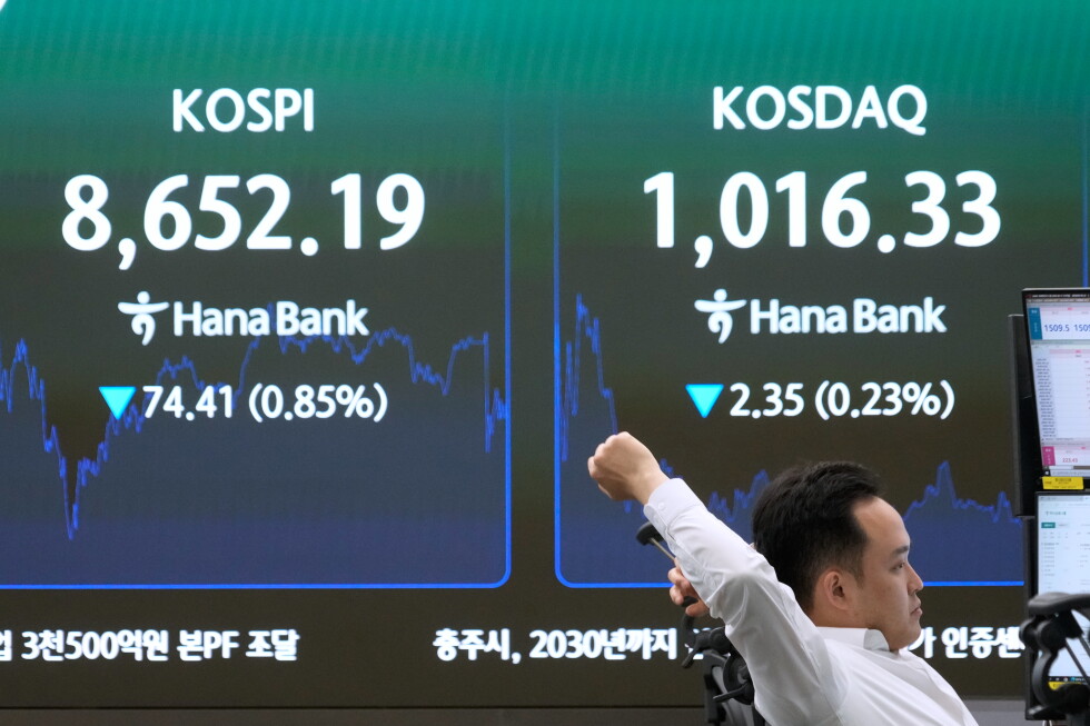 Asian shares are mixed and oil stays below $80 as world awaits details on US-Iran deal