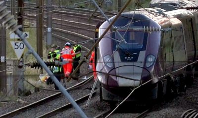 Emergency services respond to a collision of trains north of London that killed 1