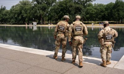 National Guard and US Park Police patrol Reflecting Pool as coating peels