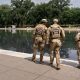 National Guard and US Park Police patrol Reflecting Pool as coating peels