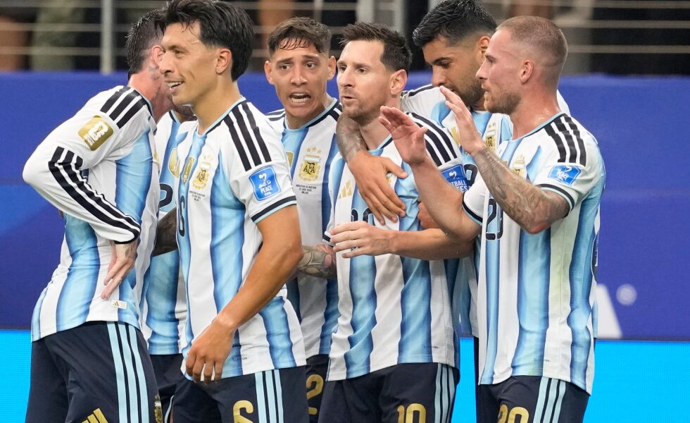 Messi sets World Cup scoring record as defending champ Argentina moves on