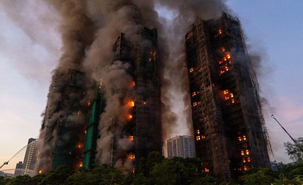 Hong Kong charges 7 people and 2 firms over massive fire that killed 168