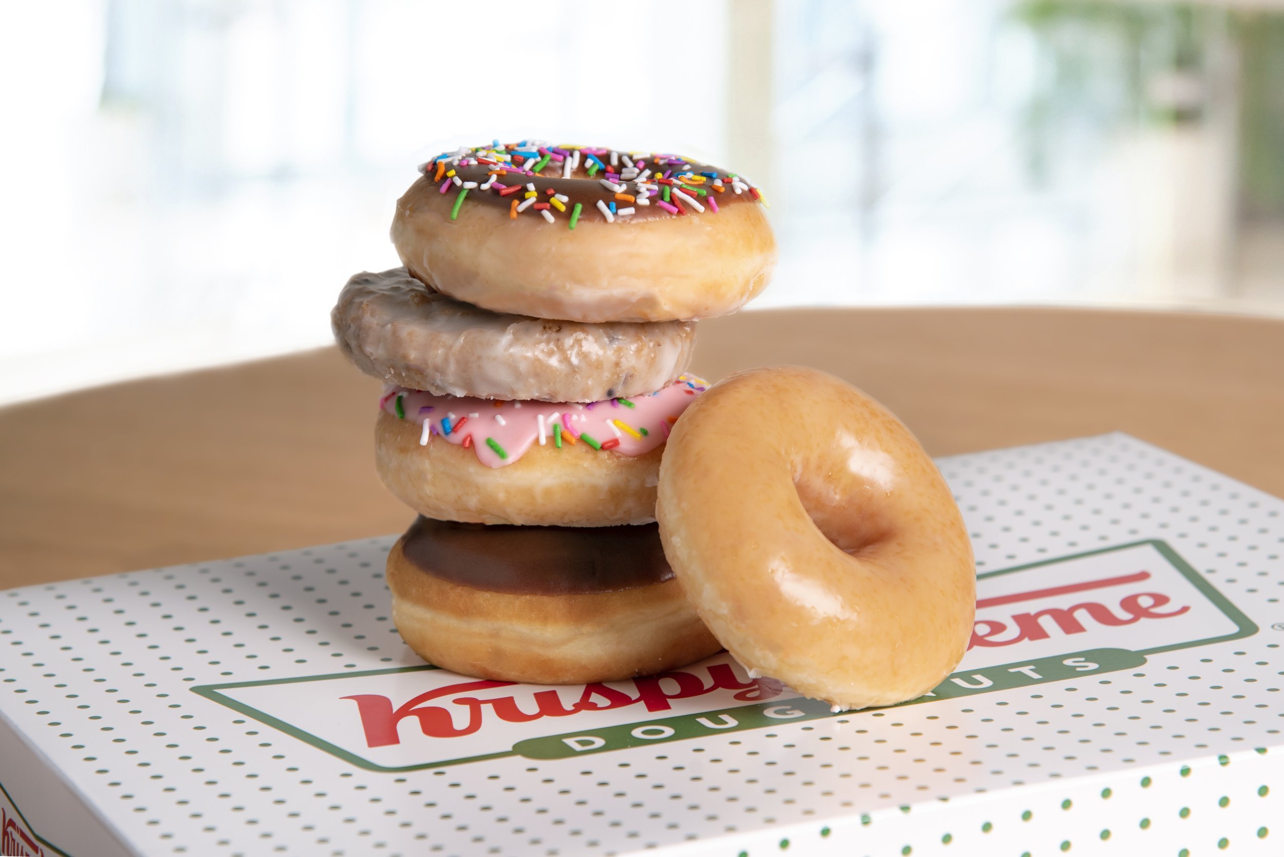 A variety of doughnuts from Krispy Kreme are pictured.