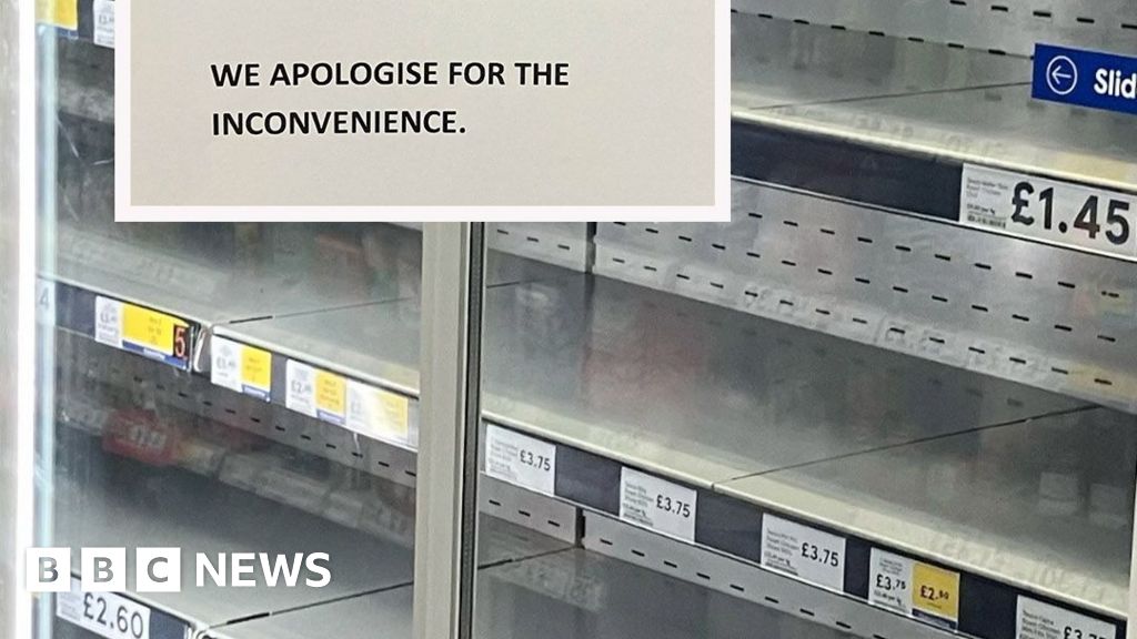 A supermarket fridge cabinet is empty. The shelves display the names of the items and prices which should be on them. A sign reads: 'Customer Notice. Due to the extreme temperatures some of our refrigeration and freezer units have broken down. Stock from these sections is unavailable at present. We apologise for the inconvenience.'