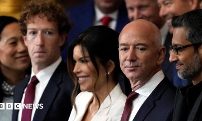 Meta CEO Mark Zuckerberg stands in a crowd next to amazon Chairman Jeff Bezos and Google CEO Sundar Pichai.