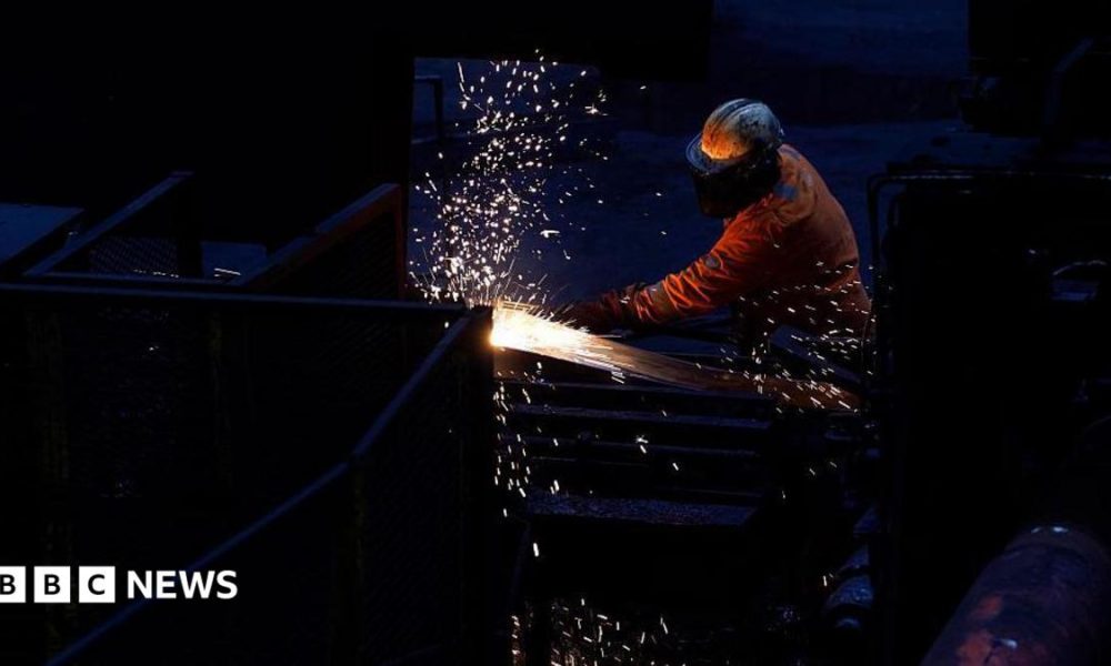 Workers in the rail and sections hot end rolling mill in Scunthorpe