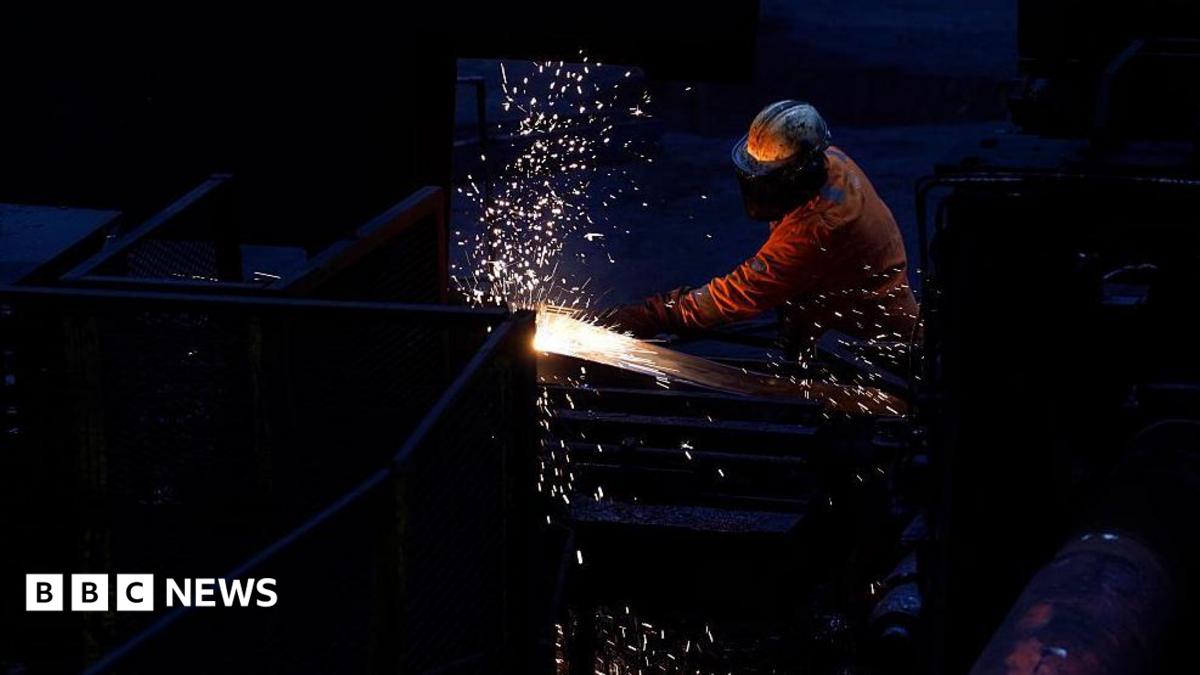 Workers in the rail and sections hot end rolling mill in Scunthorpe