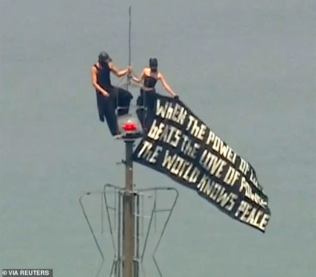 Daredevils who scaled Empire State Building facing MULTIPLE charges after flying protest banner and sky-high proposal at 1,454 feet