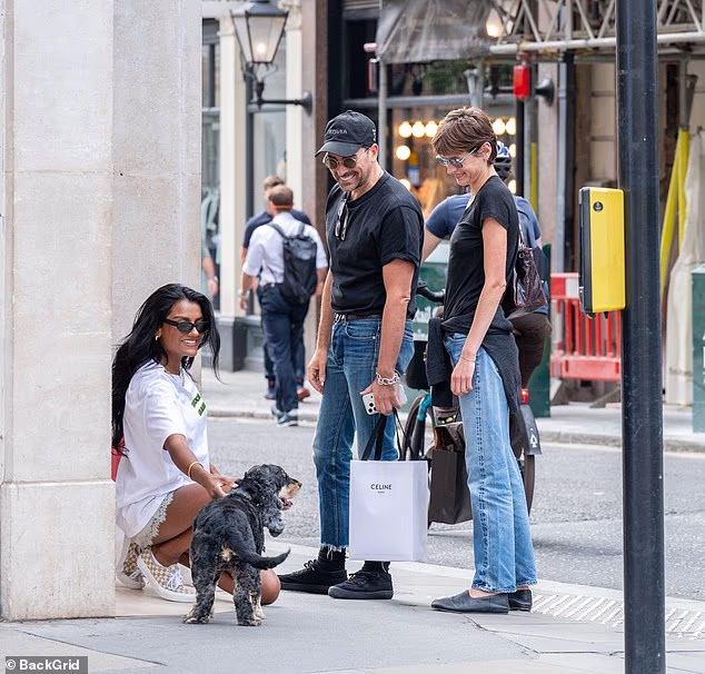 Emma Corrin and Dan Levy bumped into celebrity pal Simone Ashley while shopping on London's Bond Street together on Wednesday afternoon
