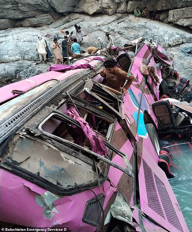 Pictured: the site of the crash in southwestern Pakistan early on Friday