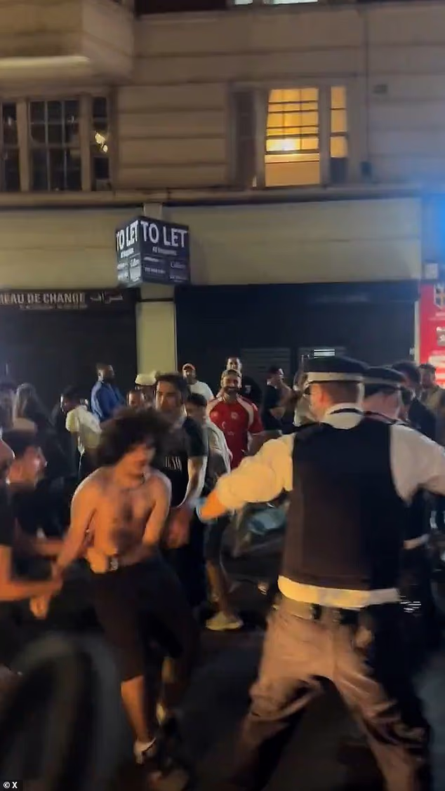 Dramatic footage from the scene captured police officers wrestling with shirtless fans as crowds spilled across the road