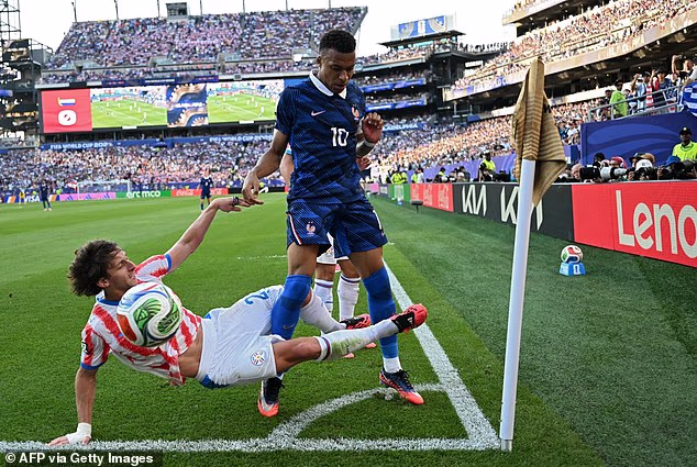 Matias Galarza (left) is seen putting in a nasty challenge on Kylian Mbappe that went unpunished