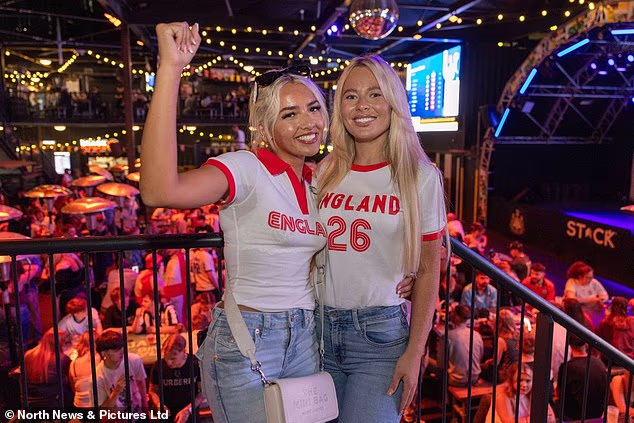 Two England fans in Newcastle gear up in the early hours of Monday for the tie with Mexico
