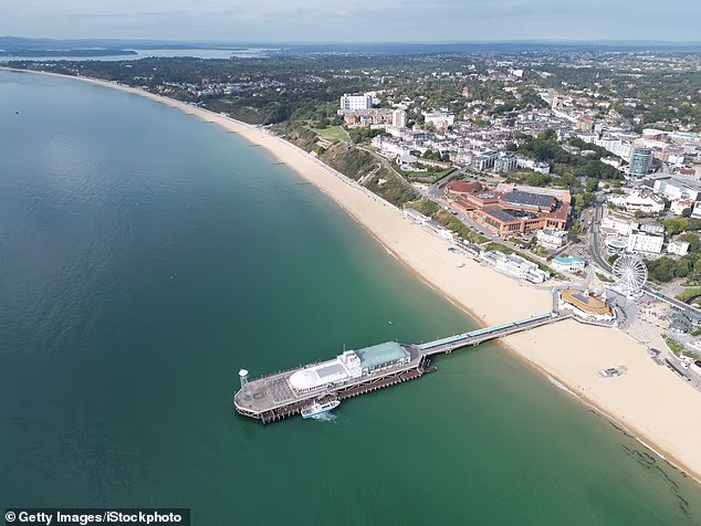 The rippling waters of the English Channel sparkled in the early evening sun and tourists and locals alike took refuge in the shade