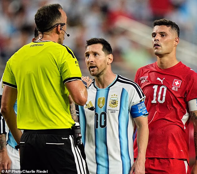 Lionel Messi approaches referee Joao Pinheiro in Argentina's World Cup quarter-final win