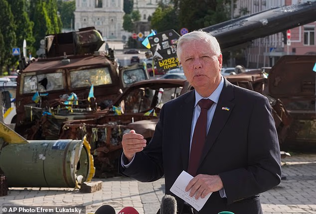 US Senator Lindsey Graham answers questions from the media near an exhibition of damaged Russian vehicles in central Kyiv, on July 10, 2026