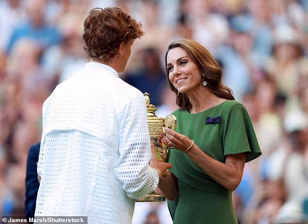 The Princess of Wales hands Italy's Jannik Sinner the Wimbledon trophy after he wins the men's singles title