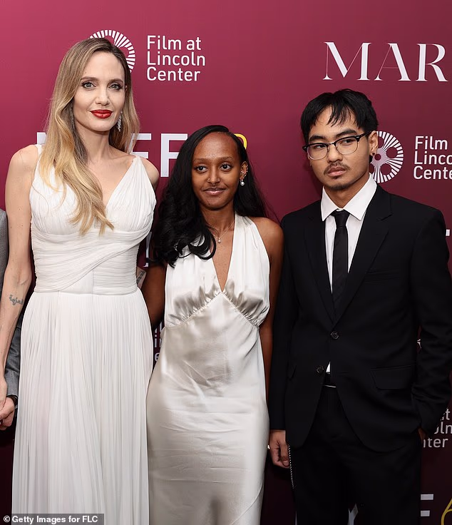 Angelina Jolie and Brad Pitt's children Zahara and Maddox have now published notices revealing their intention to drop their father's last name; Jolie pictured with her children in 2024