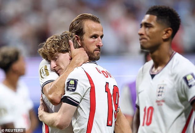 Captain Harry Kane comforts goal scorer Anthony Gordon after the final whistle following their 2-1 defeat to Argentina
