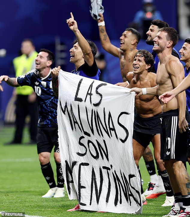 Lisandro Martinez and Giovani Lo Celso, who have played for clubs in the Premier League, celebrate with a banner claiming the Falkland Islands. Messi was also next to it celebrating