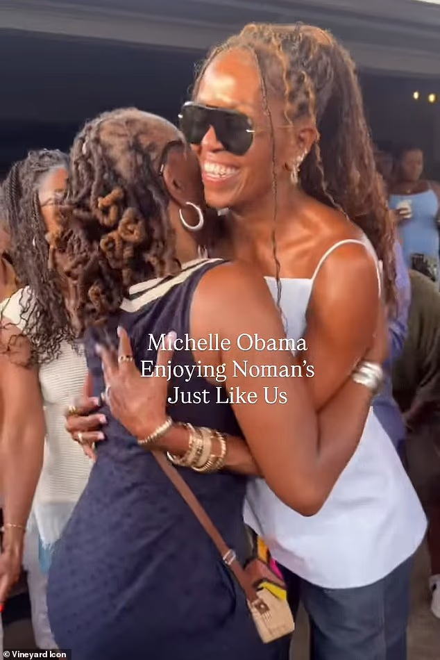 Michelle Obama was seen partying it up without her husband Barack Obama in Martha's Vineyard on Wednesday, dancing and even giving hugs out to the crowd