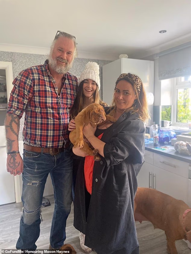 Mason Haynes, 52, was killed days before his birthday in a collision involving two motorbikes (pictured with his wife Fay Cameron-Clarke, 52, and their teen daughter Brooke)