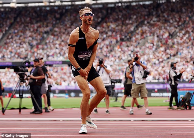 Josh Kerr celebrates after he shattered the 27-year-old world mile record in Stratford