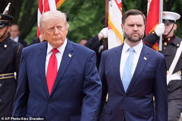 President Donald Trump, left, and Vice President JD Vance walk to the Tomb of the Unknown Soldier in Arlington National Cemetery on Memorial Day, Monday, May 25, 2026, in Arlington