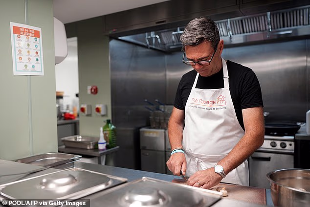 Andy Burnham this morning visited homeless charity The Passage in London just hours before being crowned PM, which he said was the ‘best place to start’ ahead of his premiership