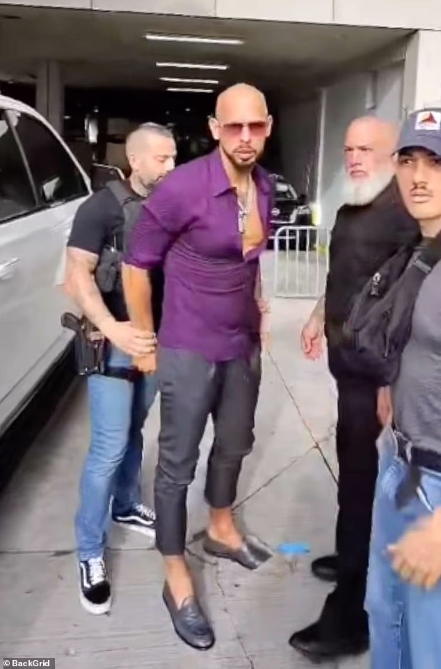 Andrew Tate (pictured being handcuffed) and his brother were arrested in Miami by US Marshals last weekend after British authorities hit them with dozens of historic rape and sexual exploitation charges. He denies wrongdoing