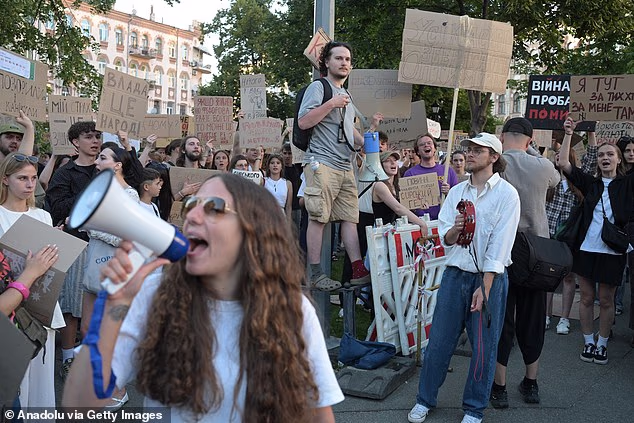 Ukrainians attend a rally to protest President Volodymyr Zelensky's decision to dismiss Defense Minister Mykhailo Fedorov, July 17