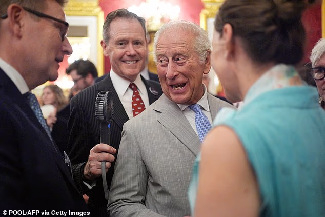 King Charles kept his top button done up and there was no question of him removing his suit... although the Master of the Household, Vice Admiral Sir Tony Johnstone-Burt, held an electric fan next to the King¿s head