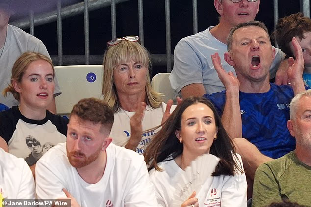 Amelie, Kate and Gerry McCann in the stands cheering on their son and brother Sean McCann at today's Commonwealth Games swimming heats